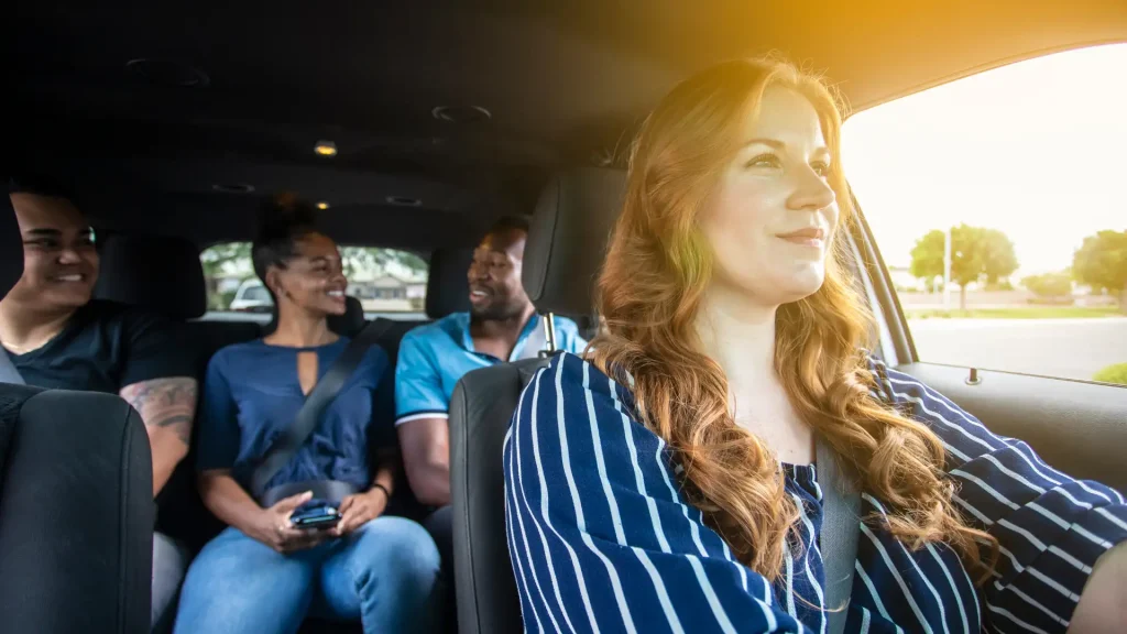 Female rideshare driver with two passengers