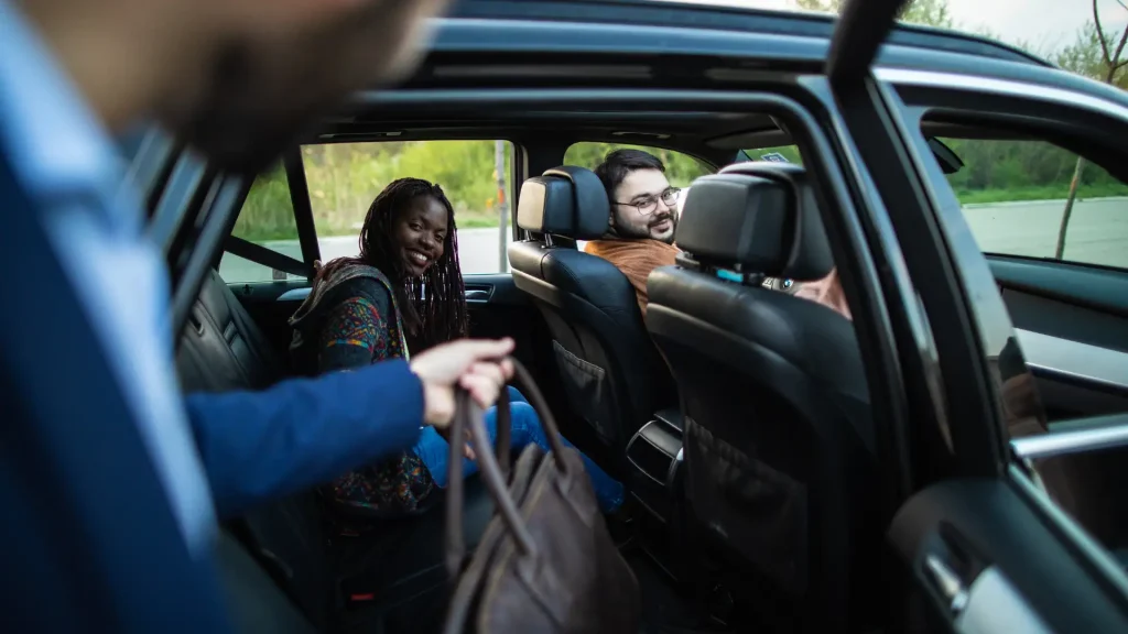 Passengers entering a rideshare vehicle