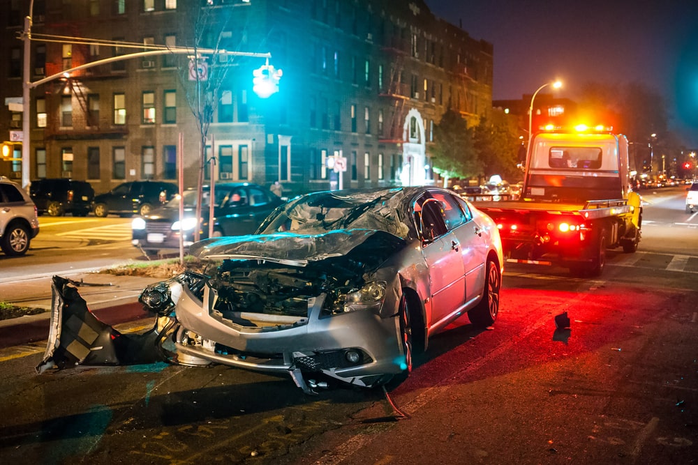 car wrecked in city middle of night