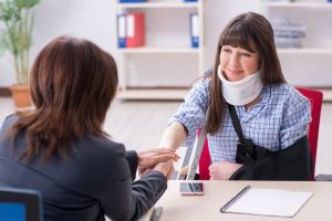 lawyer helping an injured woman