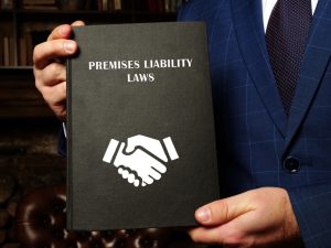 Lawyer holding book of premises liability laws